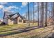 Brick home with covered patio backing to wooded area at 200 Barra Dr, Waxhaw, NC 28173