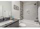 Contemporary bathroom with a walk-in shower and dark vanity at 200 Barra Dr, Waxhaw, NC 28173