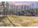 Brick home with large front yard and wooded backdrop at 200 Barra Dr, Waxhaw, NC 28173