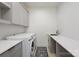 Bright laundry room with washer, dryer, and ample counter space at 200 Barra Dr, Waxhaw, NC 28173