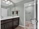 Modern bathroom with dark brown vanity and double sinks at 2056 Angel Oak Dr, Fort Mill, SC 29715