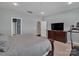 Main bedroom with a large bed, dresser, and a flat-screen TV at 2056 Angel Oak Dr, Fort Mill, SC 29715