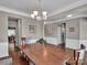 Dining room with hardwood floors and a rustic wooden table at 2056 Angel Oak Dr, Fort Mill, SC 29715