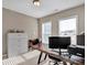 Home office with a wooden desk and built-in shelving at 2056 Angel Oak Dr, Fort Mill, SC 29715