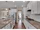 White kitchen features granite countertops and stainless steel appliances at 2056 Angel Oak Dr, Fort Mill, SC 29715