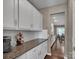 White kitchen cabinets and granite countertops with views into the dining area at 2056 Angel Oak Dr, Fort Mill, SC 29715