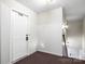 Apartment entryway with white door and carpeted flooring at 2146 S Main St, Kannapolis, NC 28081