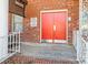 Apartment building entrance with red doors and a brick facade at 2146 S Main St, Kannapolis, NC 28081