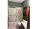 Bathroom with shower/tub combo and wood cabinet at 219 W Edison Dr, Statesville, NC 28625