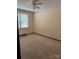 Bedroom with carpet, window, and ceiling fan at 219 W Edison Dr, Statesville, NC 28625