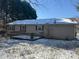 Back of house with deck and snow on ground at 219 W Edison Dr, Statesville, NC 28625