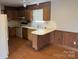 Kitchen with wood cabinets and laminate floor at 219 W Edison Dr, Statesville, NC 28625