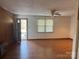 Living room with wood paneling and view of door at 219 W Edison Dr, Statesville, NC 28625