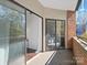 Private balcony with sliding glass doors at 224 N Poplar St # 22, Charlotte, NC 28202