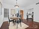 Bright dining area with wooden table and kitchen view at 224 N Poplar St # 22, Charlotte, NC 28202