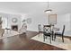 Open dining room with dark hardwood floors and wooden table at 224 N Poplar St # 22, Charlotte, NC 28202