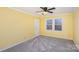 Bedroom with carpet, ceiling fan and two windows at 2241 Londonderry Dr, Gastonia, NC 28056