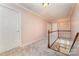 Upstairs hallway with carpet and staircase view at 2241 Londonderry Dr, Gastonia, NC 28056