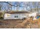 Back of house, showing yard and small patio at 225 American Dr, Salisbury, NC 28147