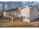 Rear view of house with shed and small yard at 225 American Dr, Salisbury, NC 28147