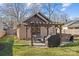 Backyard patio with pergola, firepit, and grill at 2328 Barry St, Charlotte, NC 28205