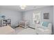 Charming Bedroom featuring a crib, armchair, and plenty of natural light at 2328 Barry St, Charlotte, NC 28205