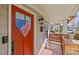 Inviting front porch with red door and American flag heart decoration at 2328 Barry St, Charlotte, NC 28205