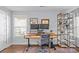 Bright home office features built-in shelving and a standing desk at 2328 Barry St, Charlotte, NC 28205