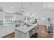 Spacious kitchen with white cabinets, a large island, and stainless steel appliances at 2328 Barry St, Charlotte, NC 28205