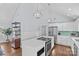 Modern kitchen island with white cabinetry and stainless steel appliances at 2328 Barry St, Charlotte, NC 28205