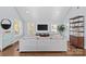 Light filled living room with hardwood floors, sectional sofa, and large windows at 2328 Barry St, Charlotte, NC 28205