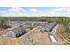 An aerial view showcases a residential development with townhomes, open spaces, and a pool, highlighting the community layout at 3113 Beacon Heights Rd, Indian Land, SC 29707