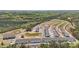 New construction aerial view highlighting townhomes, roads, and green areas, conveying a sense of community development at 3113 Beacon Heights Rd, Indian Land, SC 29707