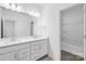 Clean bathroom with double sinks, ample cabinet space, and modern fixtures at 3113 Beacon Heights Rd, Indian Land, SC 29707