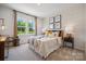 Cozy bedroom with a patterned accent wall at 3113 Beacon Heights Rd, Indian Land, SC 29707