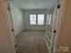 Bright and airy bedroom with plush carpeting and ample natural light, perfect for relaxation and rest at 3113 Beacon Heights Rd, Indian Land, SC 29707