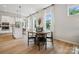 Casual dining area with a round table, black chairs, and kitchen access at 3113 Beacon Heights Rd, Indian Land, SC 29707