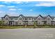 Street view of townhomes featuring sidewalks and landscaping at 3113 Beacon Heights Rd, Indian Land, SC 29707