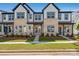 New construction townhome featuring brick accents, well-manicured lawn, and inviting walkway at 3113 Beacon Heights Rd, Indian Land, SC 29707