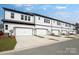 Row of townhomes with modern architecture and private driveways at 3113 Beacon Heights Rd, Indian Land, SC 29707