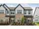 Inviting townhome with brick and siding, featuring a well-manicured lawn and charming curb appeal at 3113 Beacon Heights Rd, Indian Land, SC 29707