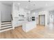 Modern kitchen with white cabinets, center island, stainless steel appliances, and pendant lighting at 3113 Beacon Heights Rd, Indian Land, SC 29707