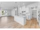 Bright, open kitchen with a center island, seamlessly flowing into the living space at 3113 Beacon Heights Rd, Indian Land, SC 29707