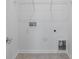 Neat laundry room with white walls, practical shelving, and tile flooring at 3113 Beacon Heights Rd, Indian Land, SC 29707