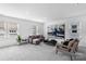 Open living room with natural light, plush seating, and modern decor for a welcoming space at 3113 Beacon Heights Rd, Indian Land, SC 29707