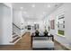 Bright interior showcasing the open layout, stairs, kitchen, and modern design elements at 3113 Beacon Heights Rd, Indian Land, SC 29707