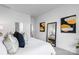 Bright, stylish main bedroom with modern decor and a view into the ensuite bath at 3113 Beacon Heights Rd, Indian Land, SC 29707