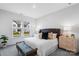 Comfortable main bedroom with a cushioned headboard, bench, and view of the neighborhood at 3113 Beacon Heights Rd, Indian Land, SC 29707