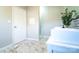 Bathroom featuring double sink vanity, modern backsplash, white door, and a shower with marble-look floors at 3416 Polkville Rd, Shelby, NC 28150