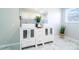 Modern bathroom with a double vanity, stylish black-and-white backsplash, and elegant marble-look floors at 3416 Polkville Rd, Shelby, NC 28150